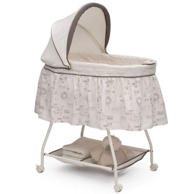 Baby bassinet featuring calming nightlight and soothing music.