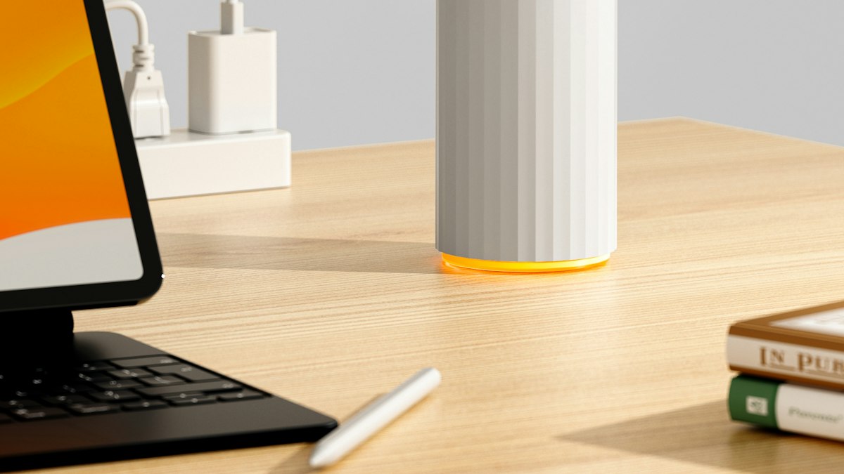 White humidifier releasing mist in a home interior